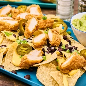Nachos topped with sliced chicken tenders