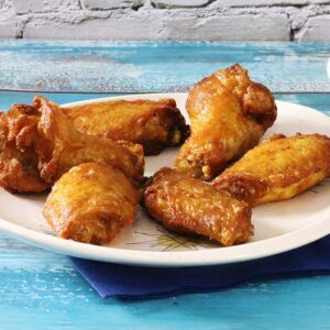 Unbreaded wings on a plate