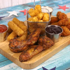 An appetizer platter with wings, boneless wings, tater tots, and mozzarella sticks