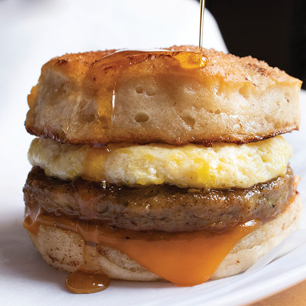 Breakfast sandwich with chicken sausage pattie, egg, and buttermilk biscuits