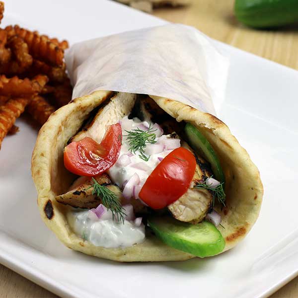 Chicken Gyro on a plate with fries