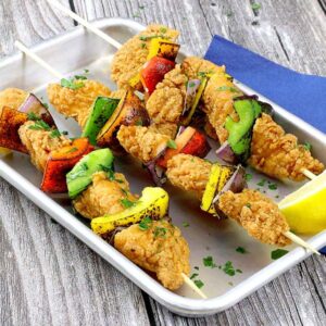 Skewers with chicken tenders, peppers, and onions