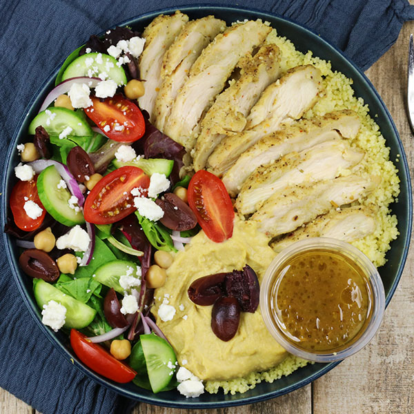 Mediterranean Bowl with Chicken, Couscous, Hummus, and Veggies