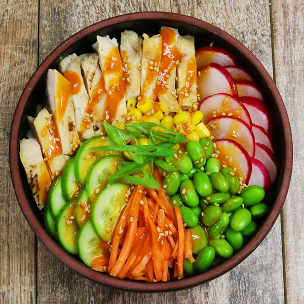 Mock Poke Bowl with Chicken, Radish, Edamame, Carrots, Cucumber, and Corn