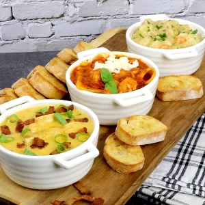 3 bowls of soup on a tray