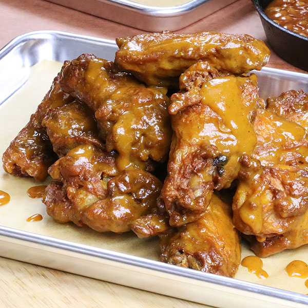 Wings covered in South Carolina-Style mustard bbq sauce