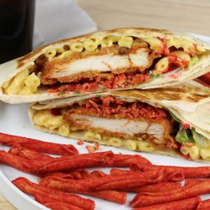 Spicy Chicken Crunch Wrap with chips on a plate