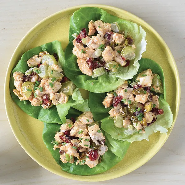 A plate with lettuce cups filled with chicken salad