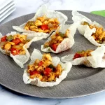 Rice paper cups filled with sweet and sour chicken