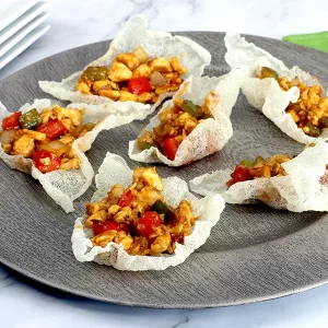 Rice paper cups filled with sweet and sour chicken
